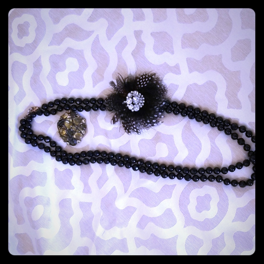 Beaded necklace with two brooches